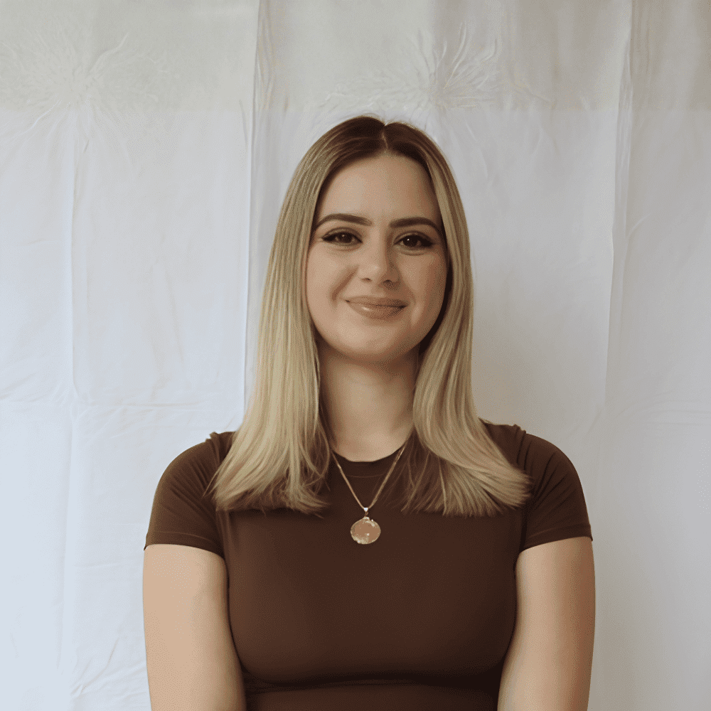 Portrait of Yllza, a professional stylist at 209 Salon and Extensions Studio, showcasing their expertise and style.