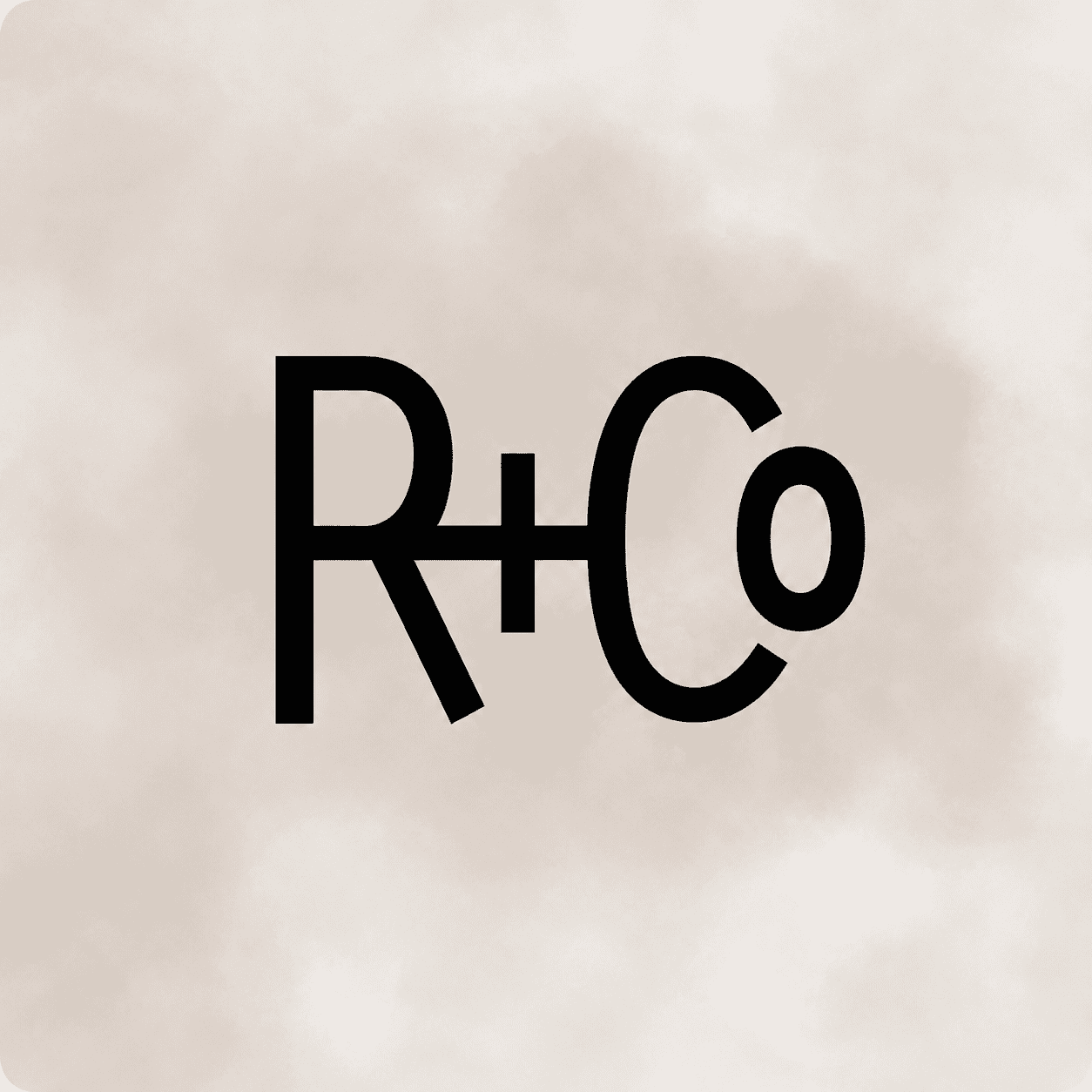 R+Co brand logo on a subtle beige background.