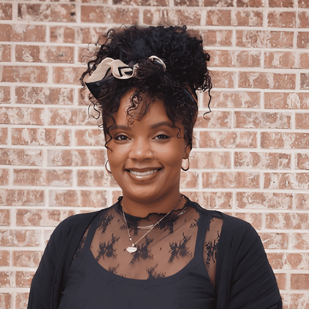 Portrait of Shauney, a professional stylist at 209 Salon and Extensions Studio, showcasing their expertise and style.