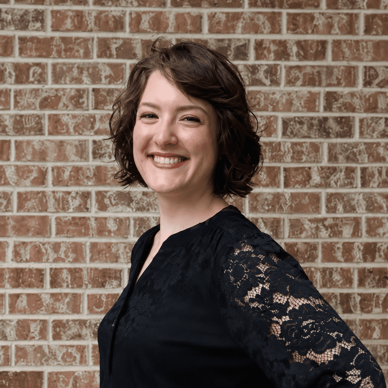 Portrait of Anna, a professional stylist at 209 Salon and Extensions Studio, showcasing their expertise and style.