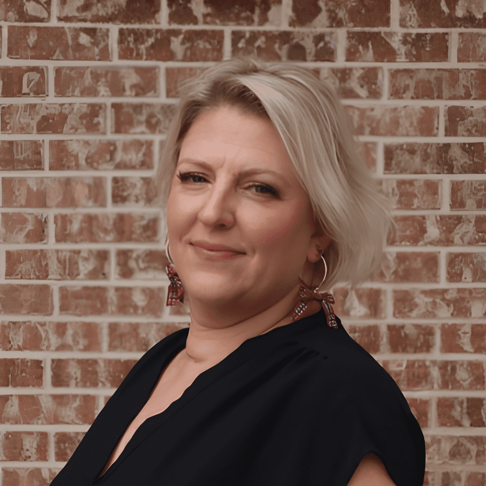 Portrait of Leslie, a professional stylist at 209 Salon and Extensions Studio, showcasing their expertise and style.