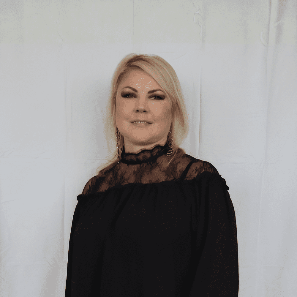 Portrait of Krystyn, a professional stylist at 209 Salon and Extensions Studio, showcasing their expertise and style.