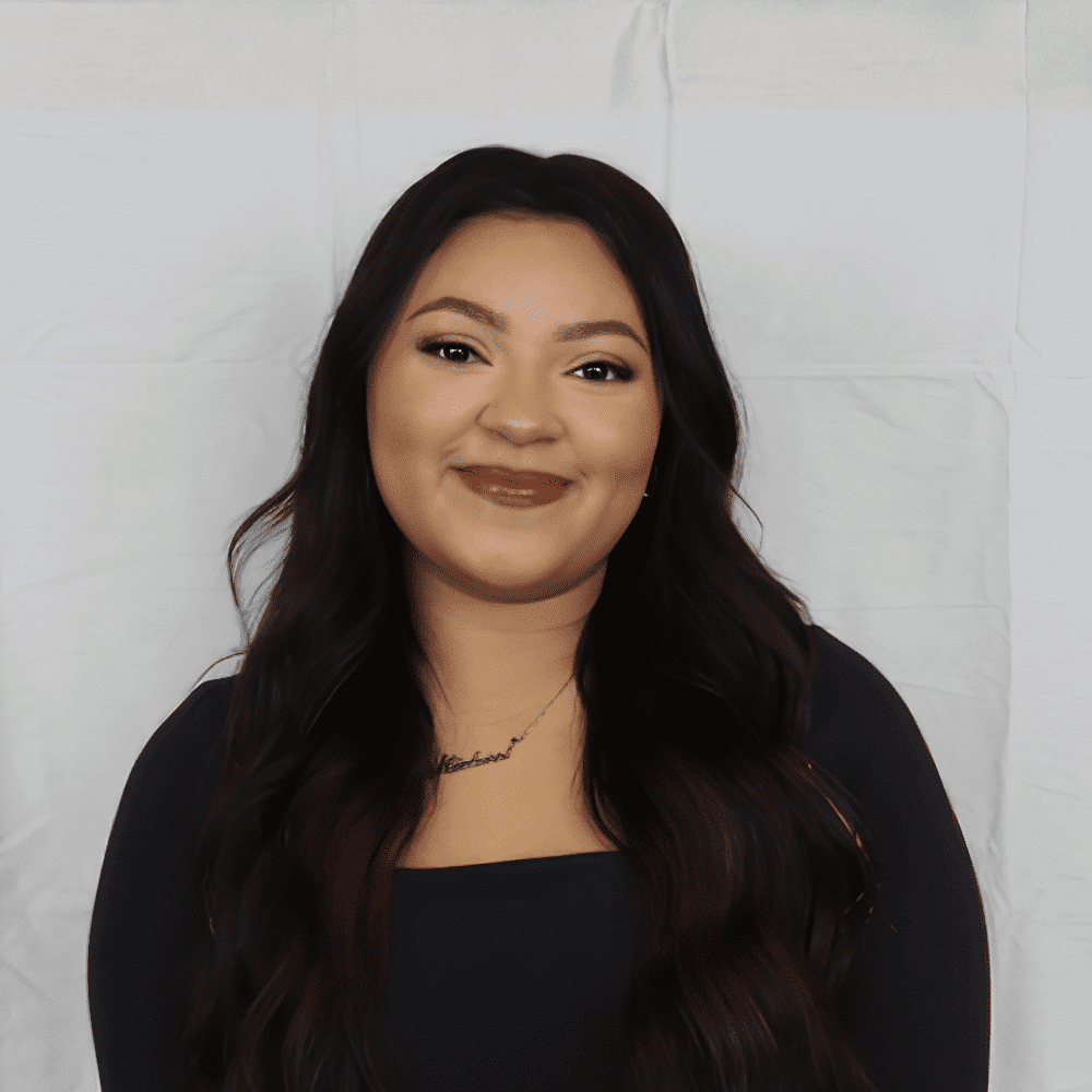 Portrait of Imani, a professional stylist at 209 Salon and Extensions Studio, showcasing their expertise and style.