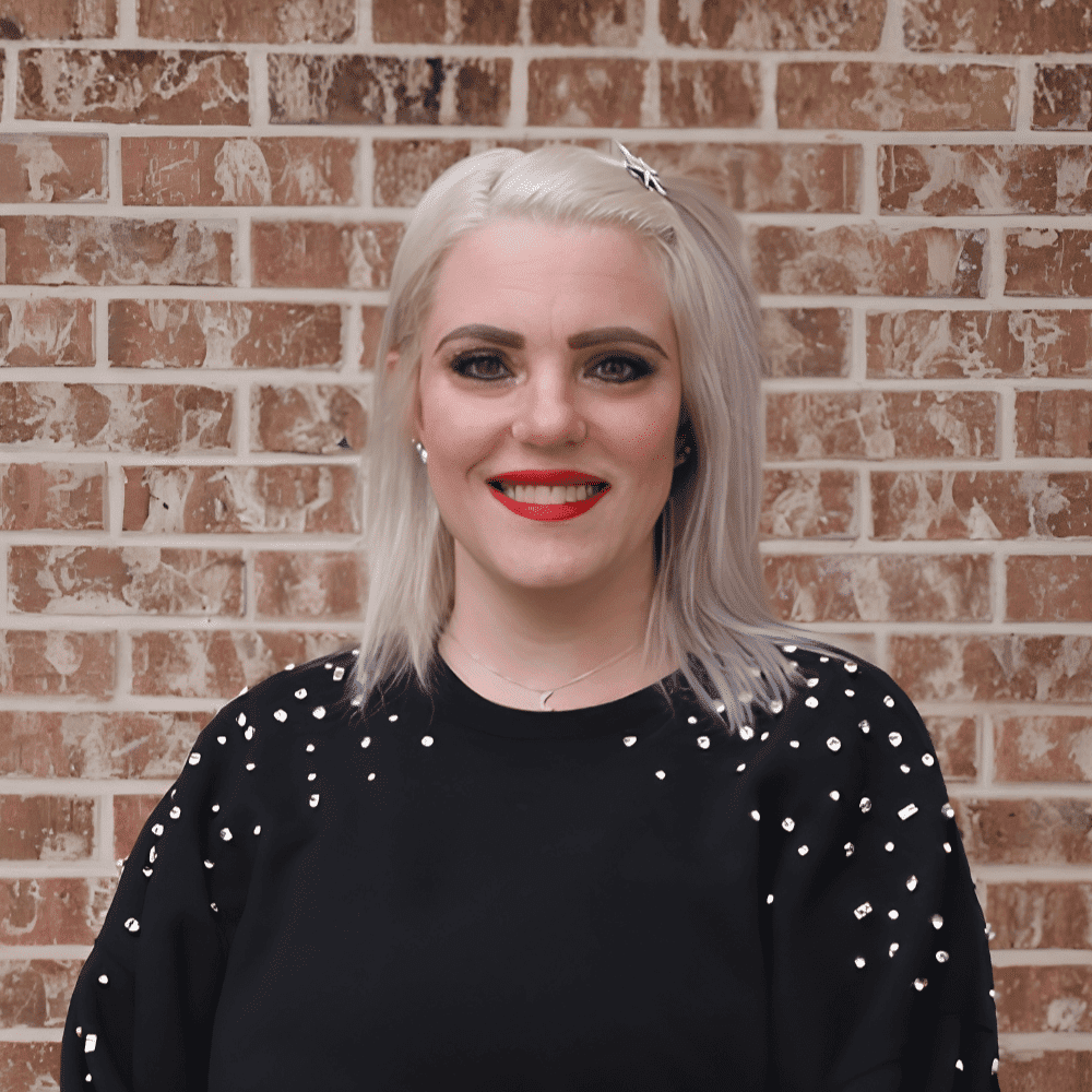Portrait of Francesca, a professional stylist at 209 Salon and Extensions Studio, showcasing their expertise and style.