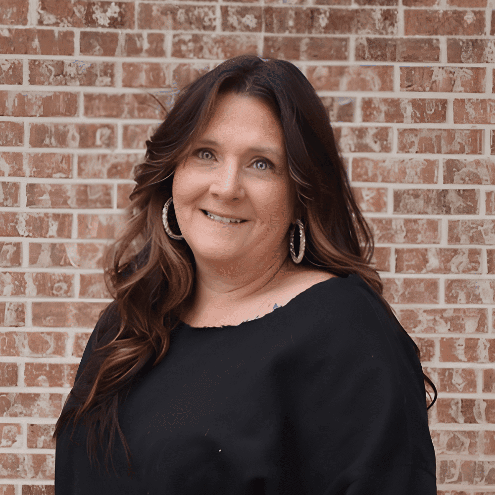 Portrait of Marcia, a professional stylist at 209 Salon and Extensions Studio, showcasing their expertise and style.