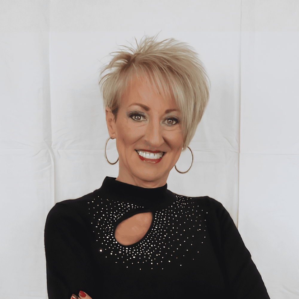 Portrait of Melinda, a professional stylist at 209 Salon and Extensions Studio, showcasing their expertise and style.