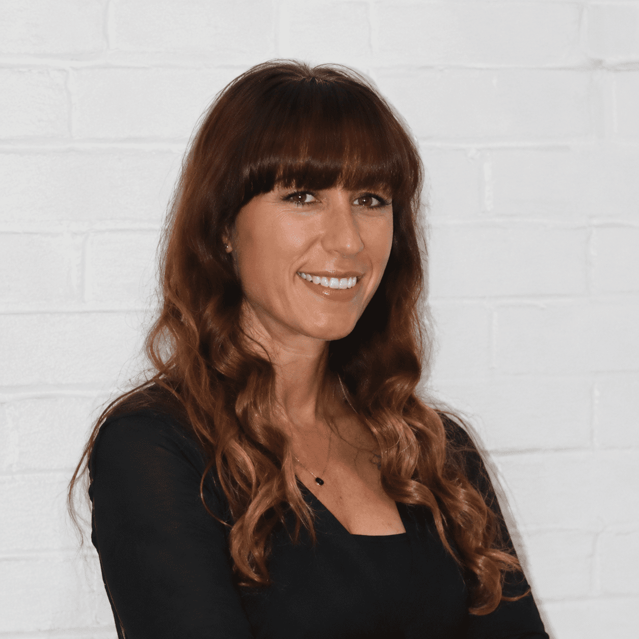 Portrait of Heidi, a professional stylist at 209 Salon and Extensions Studio, showcasing their expertise and style.