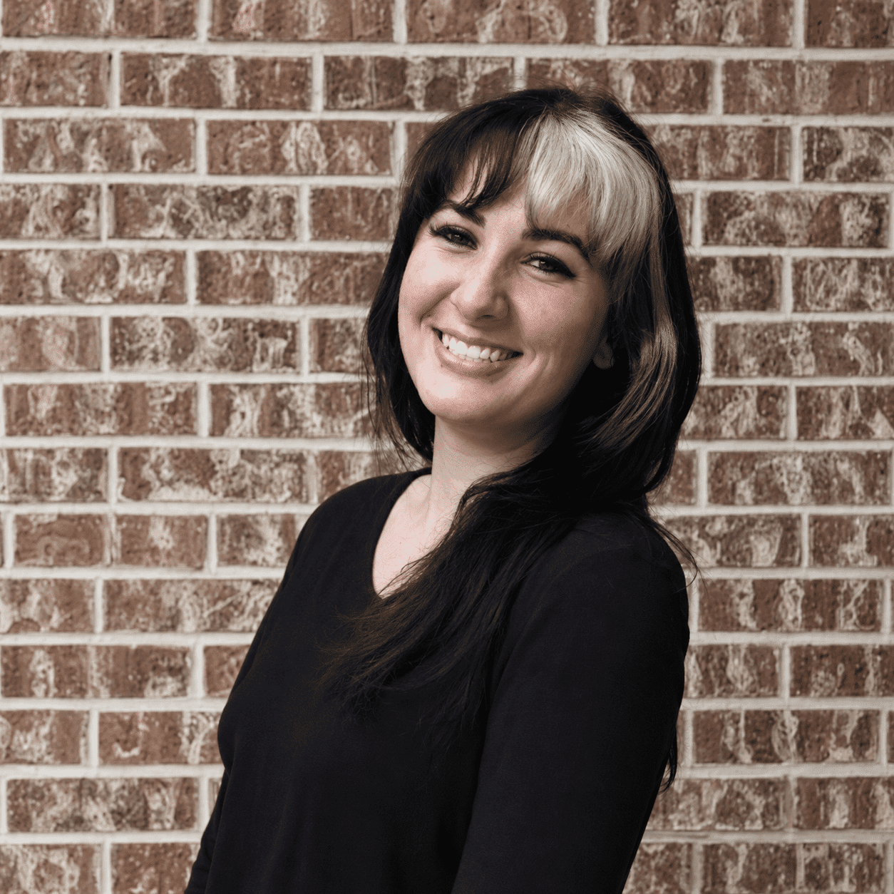 Portrait of Grace, a professional stylist at 209 Salon and Extensions Studio, showcasing their expertise and style.